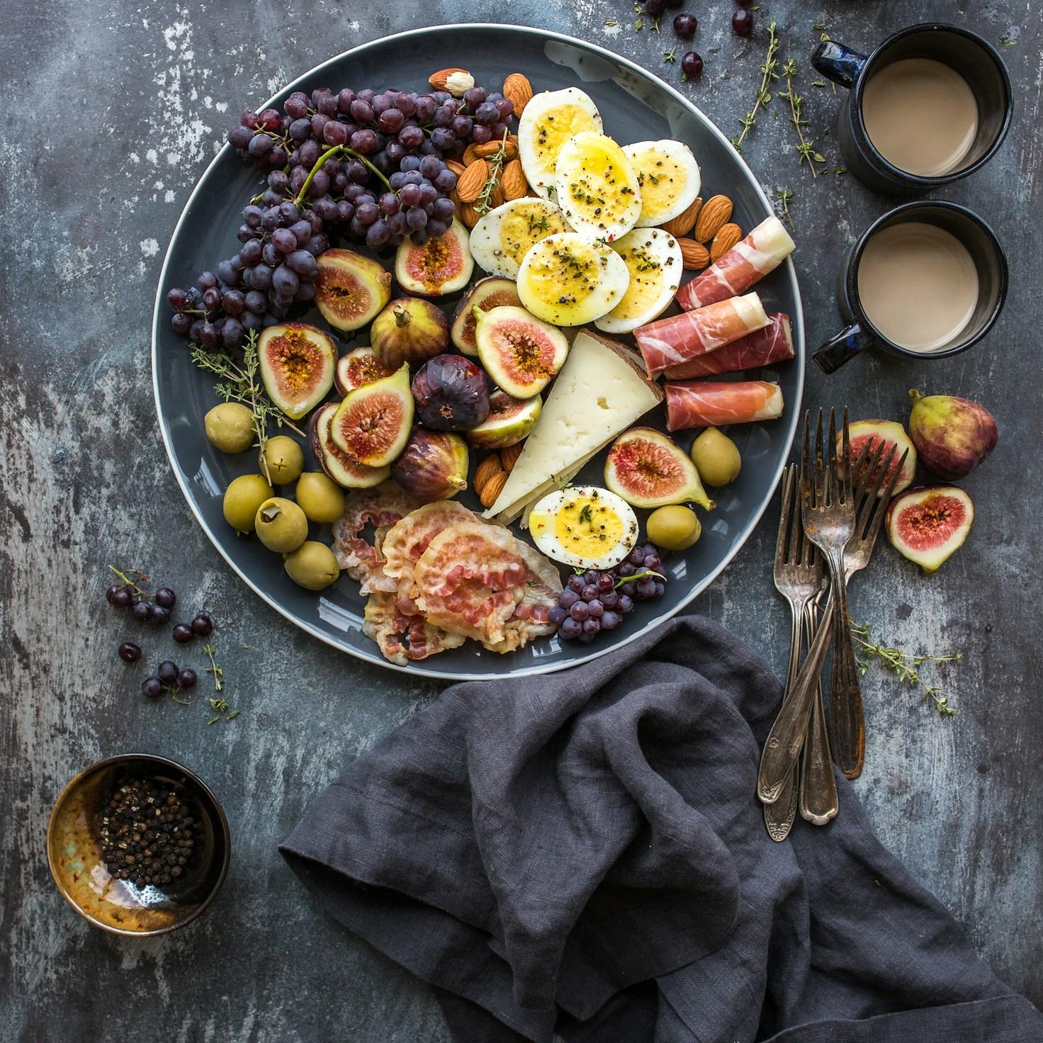 Diverse group of community members sharing a meal together, showcasing the social bonds formed through collaborative cooking